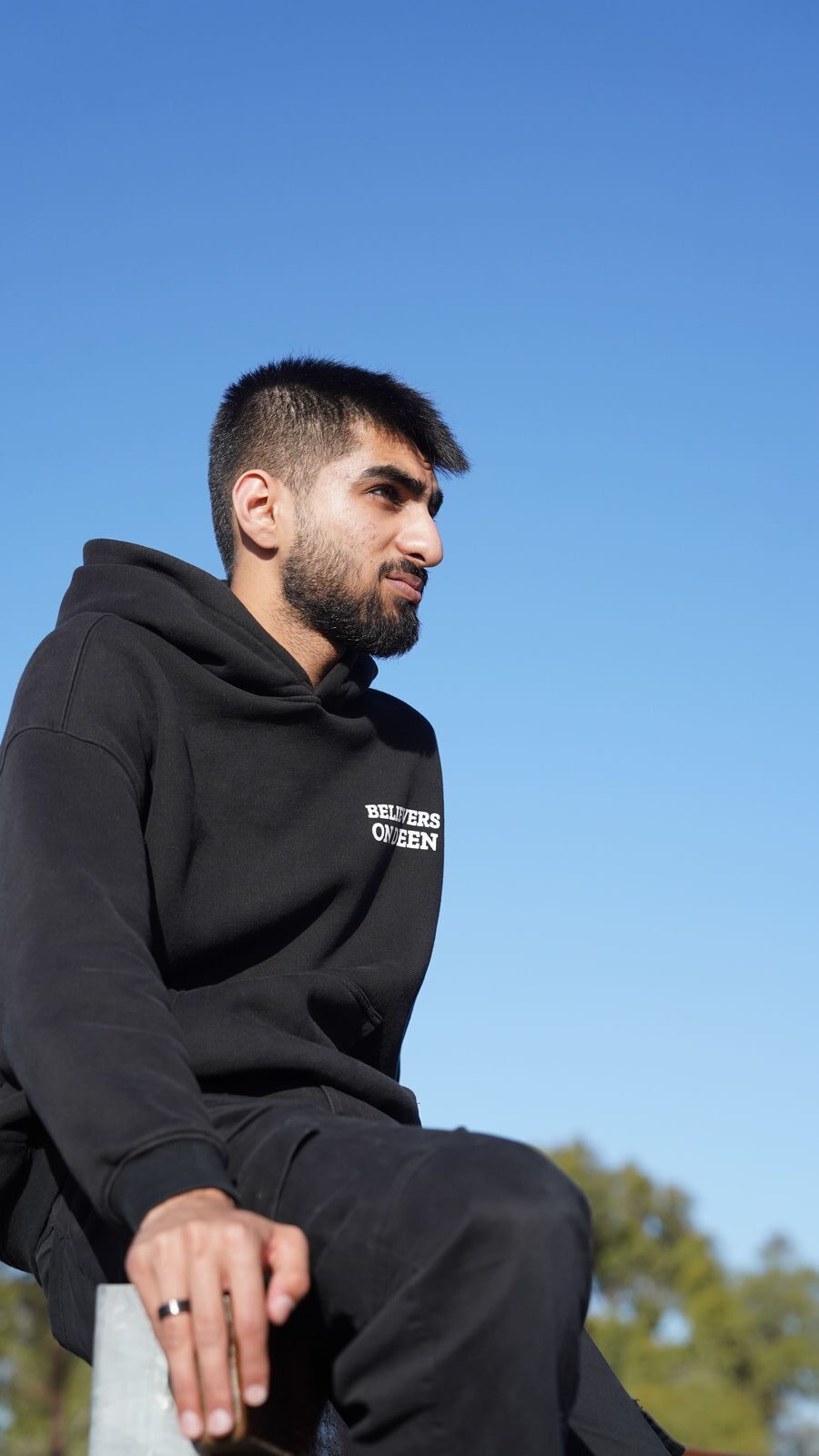 United Ummah Hoodie in black — worn
